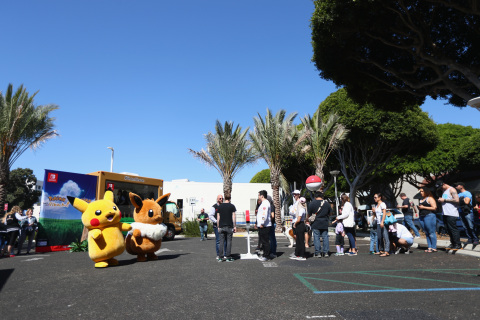 In this photo provided by Nintendo of America, fans take photos with Pikachu and Eevee while waiting in line to play the Pokémon: Let’s Go, Pikachu! and Pokémon: Let’s Go, Eevee! games. Pokémon: Let’s Go, Pikachu! and Pokémon: Let’s Go, Eevee! launch in Nintendo eShop on the Nintendo Switch system and at retailers on Nov. 16. The immersive Poké Ball Plus controller that can be used to play the games also hit stores the same day. (Photo: Business Wire)