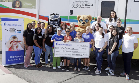 Kelly Simonson, president of Health Plan of Nevada (center) and, to her right, Stephanie Kirby, executive director of Eye Care 4 Kids, joined UnitedHealthcare volunteers for a $5,000 check presentation to Eye Care 4 Kids Nevada during a no-cost comprehensive eye exam as part of eye health event Saturday, Sept. 29, 2018, in Las Vegas. The event is part of a nationwide grant program by UnitedHealthcare (Photo: Isaac Brekken).