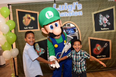 In this photo provided by Nintendo of America, Joshua A., 9, and Jacob A., 6, of Brooklyn, NY, get into the Halloween spirit during a special event at the Nintendo NY store in Rockefeller Plaza by joining Luigi for a ghost-hunting activity. The spooky classic game Luigi’s Mansion will be available for the Nintendo 3DS family of systems on Oct. 12. (Photo: Business Wire)