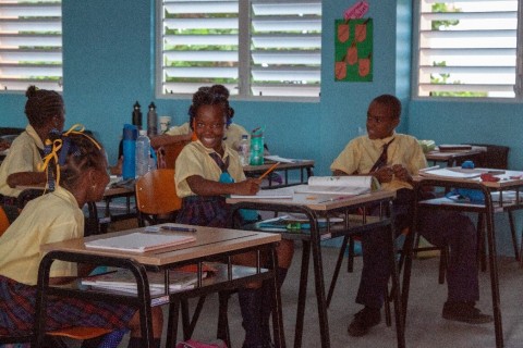 Students happy to be back in the classrooms at the Paix Bouche Primary & Pre-School (Photo: Business Wire)