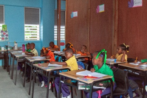 Students happy to be back in the classrooms at the Paix Bouche Primary & Pre-School (Photo: Business Wire)