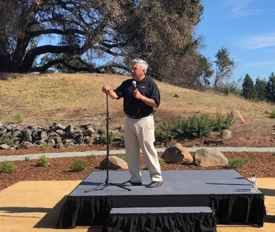 Keysight CEO Ron Nersesian addresses employees at a tree-planting ceremony to commemorate the one-ye ... 