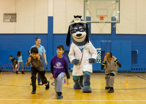Members of Boys & Girls Clubs of San Antonio were led through exercises with UnitedHealthcare mascot Dr. Health E. Hound and Marian Cabanillas of UnitedHealthcare to test their new NERF ENERGY Game Kits that tracks activity earning "energy points" in order to play the game. Today's donation of 75 kits is part of a national initiative between Hasbro and UnitedHealthcare, featuring Hasbro's NERF products, that encourages young people to become more active through "exergaming" (Photo: Katie Clementson)  
