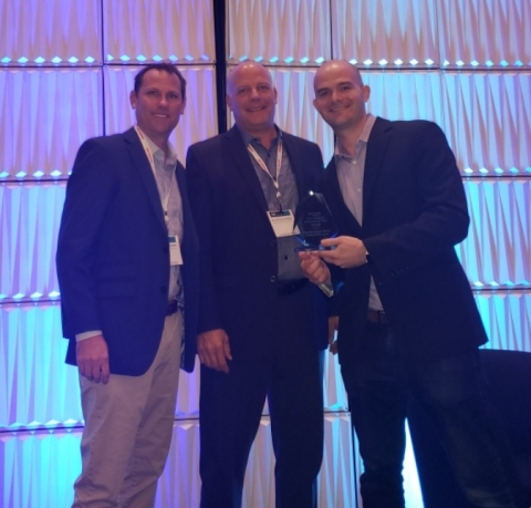 TNS’ Mike Schinnerer (left) and David Kaemmer (middle) receive the Fierce Innovation Award for Customer Engagement (Photo: Business Wire) 