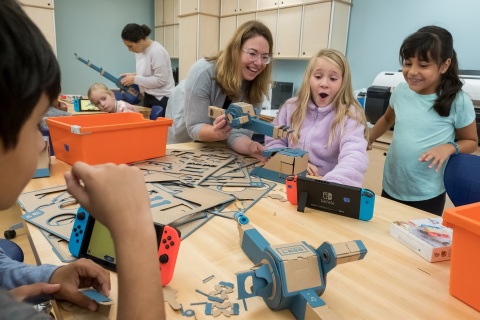 In this photo provided by Nintendo of America, third-grade students at the Douglass G Grafflin School in Chappaqua, New York, participate in an interactive learning session with the Nintendo Labo: Variety Kit for the Nintendo Switch system, led by Rebecca Rufo-Tepper, Co-Executive Director of the Institute of Play. On Oct. 23, Nintendo and the Institute of Play announced a partnership to bring Nintendo Labo kits into elementary classrooms nationwide. The program combines the innovative play of Nintendo Labo with the basic principles of science, technology, engineering, art and mathematics (STEAM) to inspire kids and help make learning fun.