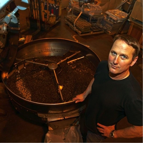 John Weaver and his Probat Coffee Roaster (Photo: Business Wire)