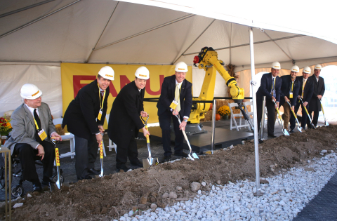 A FANUC robot helps company executives and local dignitaries break ground on new facility in Auburn  ... 