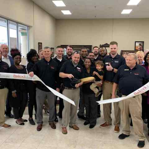 
Members of Badcock's corporate executive team, store owner Robert Bennett and community supporters happily cut the grand opening ribbon to officially welcome the store to the Meridian, Mississippi community. (Photo: Business Wire)