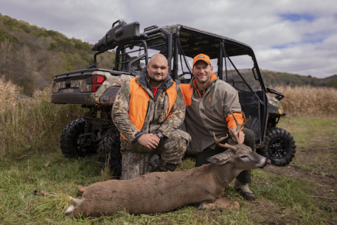 Joe Thomas and veteran Brett Rogers with the buck Thomas hit earlier in the day during the Heroes Hunt at LEEK Hunting & Mountain Preserve in partnership with Polaris RANGER. (Photo: Business Wire)