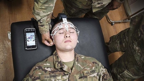 Army medic training on the BrainScope Device, an objective medical tool used for the assessment of t ... 