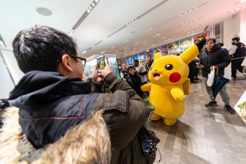 In this photo provided by Nintendo of America, Pikachu celebrates with fans who lined up to be among the first to purchase the Pokémon: Let's Go, Pikachu! and Pokémon: Let's Go, Eevee! games at the Nintendo NY store on Nov. 16, 2018. The immersive Poké Ball Plus accessory that can be used to play the games also hit stores on Nov. 16. (Photo: Business Wire)