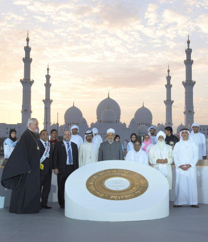 Saif bin Zayed, Khalifa bin Tahnoun, alongside religious and spiritual leaders in front of a memorial to express commitment to child protection (Photo: AETOSWire)