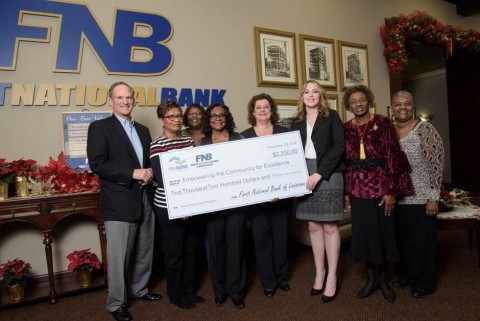 First National Bank of Louisiana and the Federal Home Loan Bank of Dallas awarded $2,200 in Partnership Grant Program funds to Empowering the Community for Excellence, a nonprofit that provides free academic tutoring to underprivileged students. (Photo: Business Wire)