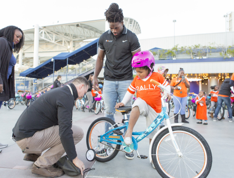 Rally Health and Los Angeles Chargers running back Melvin Gordon gift new bicycles to 100 children from Falcons Youth and Family Services at the third annual Rally Health Holiday Bike Build at the StubHub Center. (Photo: Rally Health)