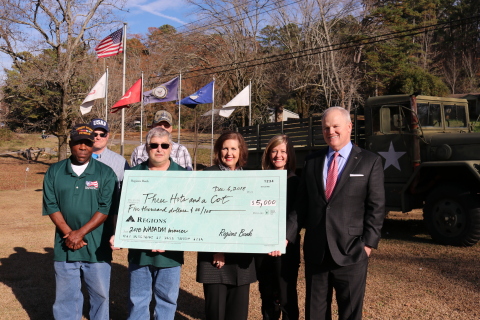 Leaders from Regions Bank present a $5,000 grant to the nonprofit Three Hots and a Cot in metro Birm ... 
