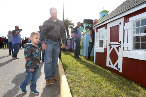 A BACH client sees his custom-built playhouse for the first time. (Photo: Business Wire)
