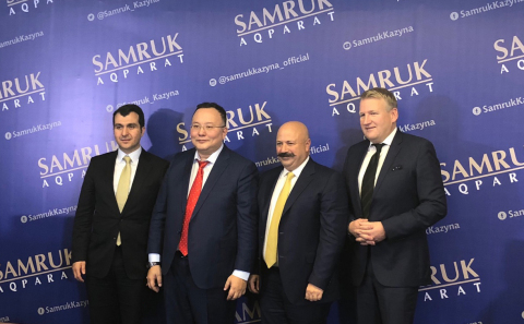 From left, Turkcell CFO Osman Yilmaz, Chairman of the Board of Kazakhtelecom Kuanyshbek Yessekeev, T ... 