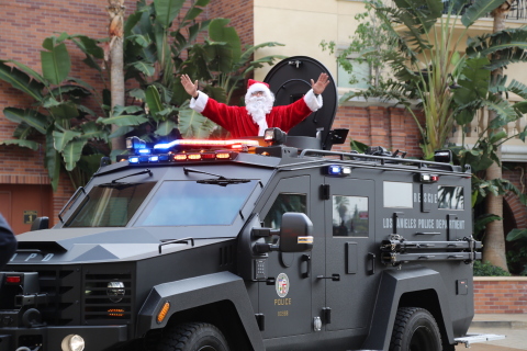 Who needs a sleigh? After a dramatic flyover on the Los Angeles Police Department’s SWAT helicopter, Santa arrives in the SWAT team’s armored response vehicle before handing out gifts to nearly 2,000 children and families at the Orthopaedic Institute for Children’s 28th annual Toys and Joy holiday party. (Photo: Business Wire)