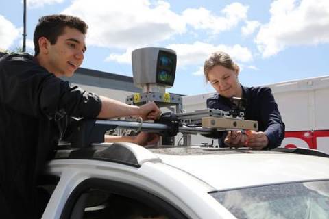 Robert Adragna (left) and teammate, both from University of Toronto, participants in the AutoDrive Challenge. (Photo: Business Wire)