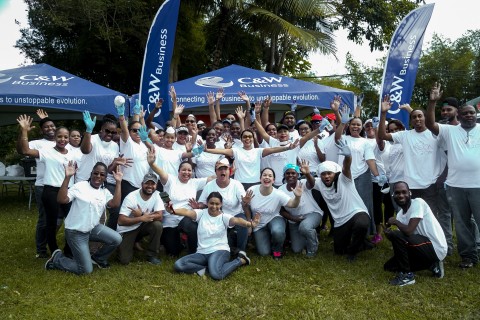 C&W/Flow Trinidad team members do their part on Mission Day (Photo: Business Wire)