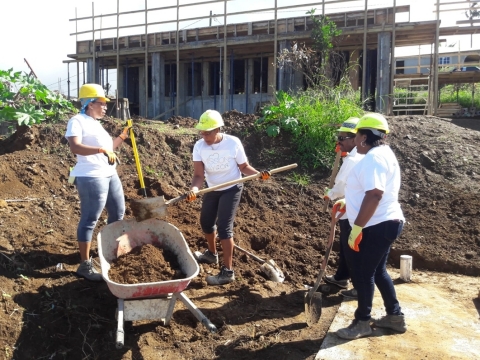 C&W/Flow Dominica employees hard at work in the community on Mission Day (Photo: Business Wire)