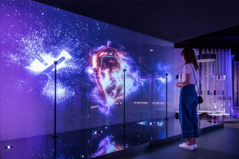 Create your own custom art piece by interacting with "The Art of You," a large-scale digital wall in the Future X Smart Store that reads your facial expressions as well as head, eye and mouth movements. (Photo: Business Wire)
