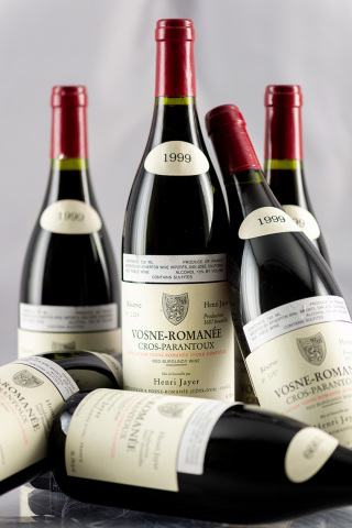 Three of the top selling lots of 2018 at Acker Merrall & Condit: 1999 H. Jayer Vosne Romanee Cros Parantoux (sold USD$153,600); incredibly rare 1863 Niepoort in Lalique Vintage Port (sold USD$128,000); and 1999 DRC Romanee Conti (sold USD$124,000) (Photo: Business Wire)