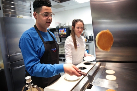 Coleman Giles, 15, cooks pancakes at the IHOP test kitchen in Glendale, California. Coleman, who was treated at a Children’s Miracle Network Hospital in Los Angeles, California, was chosen as one of three IHOP Kid Chef finalists to help kick off the annual fundraising campaign leading up to IHOP Free Pancake Day on Tuesday, March 12. (Photo: Business Wire)