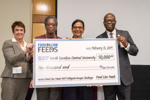 Food Lion President Meg Ham (left), N.C. Central University Chancellor Dr. Johnson O. Akinleye, with staff from North Carolina Central University. (Photo: Business Wire)