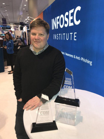 Jack Koziol, CEO and founder of InfoSec Institute, with the Cyber Defense Magazine trophies. (Photo: Business Wire)