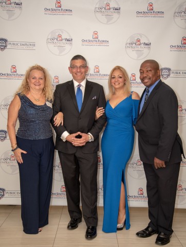 Serge Mallat & Jessica Padin from OneSouth Florida Wealth Advisors hosting their Sports and Entertainment Grand Opening. Photographed along side Dana Lee Csutoros & V. Bernard Jones of ExpoZur Sports Marketing Group. (Photo: Business Wire)