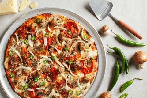 The new Spicy Milano Pizza features CPK’s crispy thin crust topped with spicy fennel sausage and pepperoni, serrano peppers, Cremini mushrooms, onions, spicy marinara, wild Greek oregano, as well as fresh Mozzarella and Romano cheeses. (Photo: Business Wire)