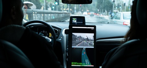 A photo from December 2018 shows the interior cabin of a Mobileye autonomous vehicle as it maneuvers ... 