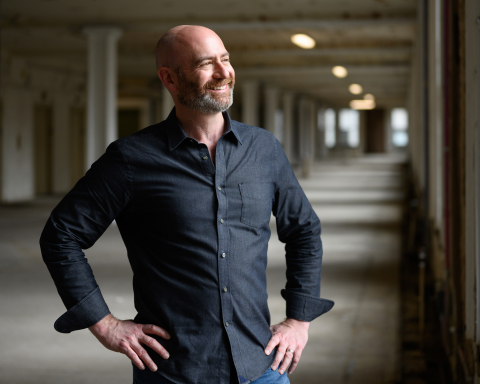 PhotoShelter announces $8 million in funding from Level Structured Capital. (Pictured: PhotoShelter CEO Andrew Fingerman in the company's soon-to-be new headquarters in New York City's Financial District)