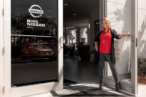HGreg Nissan Delray associate, Tara, welcomes customers to the automotive group's first new car dealership in U.S., in Delray Beach, Fla., March 6, 2019. (Photo: Business Wire)