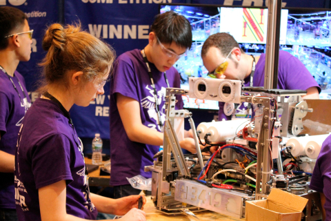 Students work on their robot at a previous FIRST competition. (Photo: Business Wire)