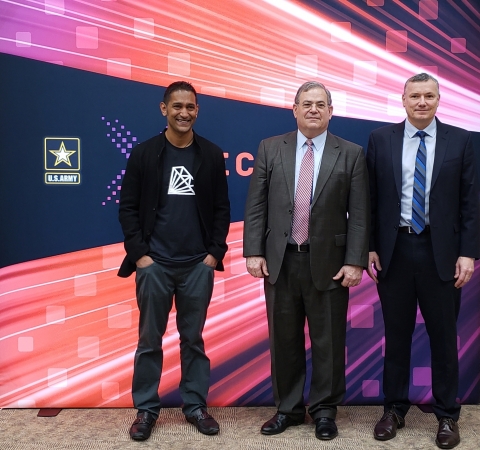 AKHAN Founder & CEO Adam Khan (left) and Senior Electrical Engineer Ernest Schirmann (right) with Jeffrey White, Principal Deputy Assistant Secretary of the Army for Acquisition, Logistics, and Technology. (Photo: Business Wire)