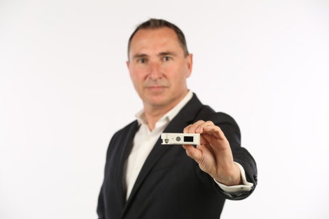 Thar Casey, CEO Amber Solutions with Amber's Premium Solid-State Smart Circuit Breaker (Photo: Business Wire)