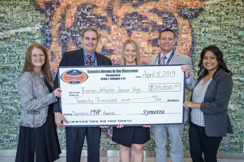Symetra presented the 2018 Symetra Heroes in the Classroom® MVP Award to Thomas Jefferson Jr. High School in Woodridge, Ill. The education grant will fund a new student programming, “Learning through the Lens of Equity.” (left to right: Tracy Wort, Symetra; Woodridge School District 68 Superintendent Patrick Broncato; Jefferson teacher Jennifer Riskus; Jefferson principal Justin Warnke; Sharmila Swenson, Symetra) (Photo: Business Wire)
