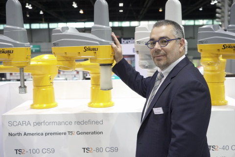 Sebastien Schmitt, Robotics Division Manager, Stäubli North America, showcases the company's new TS2 robots, which feature a modular design and incorporate Stäubli’s proprietary JCS drive technology. (Photo: Business Wire)
