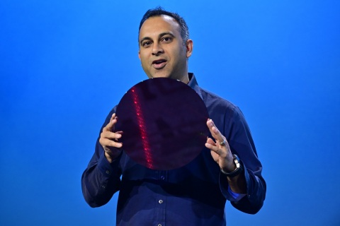 Navin Shenoy, Intel executive vice president and general manager of the Data Center Group, displays a wafer containing Intel Xeon processors during a keynote on Tuesday, April 2, 2019. In San Francisco on April 2, Intel Corporation introduces a portfolio of data-centric tools to help its customers extract more value from their data. (Credit: Walden Kirsch/Intel Corporation)