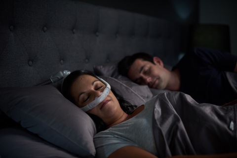 AirFit P30i nasal pillows tube-up CPAP mask, woman sleeping (Photo: Business Wire)