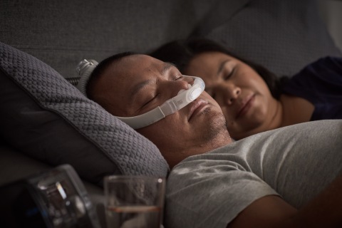 AirFit P30i nasal pillows tube-up CPAP mask, man sleeping, close up (Photo: Business Wire)