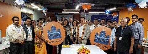 Andy Lee, Chairman and CEO; Joyce Lee, Chief Culture Officer; Bhaskar Menon, Chief Transformation Officer; and the entire Alorica India team celebrate the opening of its new innovation lab and digital business process management operations. (Photo: Business Wire)