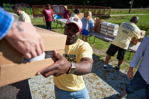 A Food Lion associate in Durham, N.C., prepared to distribute food after renovating a local food pantry as part of Food Lion Feeds' Great Pantry Makeover effort. (Photo: Business Wire)