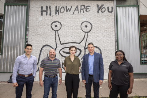 Community Assistant and UT Student Leo Gutierrez, American Campus Communities CEO Bill Bayless, HHAY Project Co-founders Courtney Blanton and Tom Gimbel, Community Assistant and UT Student Victoria Omodele in front the mural by Daniel Johnston. (Photo: Business Wire)