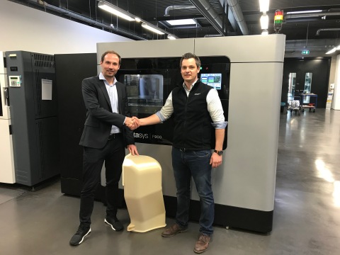 André Bialoscek Head of Vehicle Physical Integration Hennigsdorf, Bombardier, holding a 3D printed Air Duct, and Dominik Mueller, Strategic Account Manager at Stratasys (Photo: Business Wire)