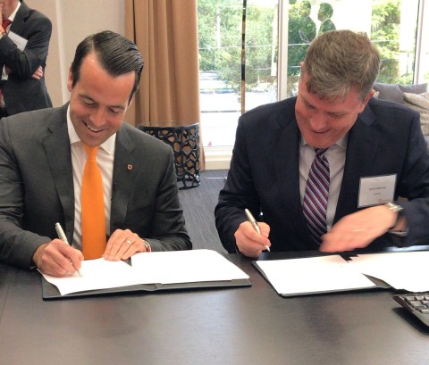 Brian Neff, Sintavia's Founder and CEO and David Preston, Executive Vice President at Howco Group, sign a term sheet to form a joint venture in support of the development of additive manufacturing within the Oil & Gas industry. (Photo: Business Wire)