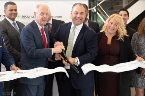 Brian Falconer (in green tie) of Securian Advisors of New England and Braintree Mayor Joseph Sulliva ... 