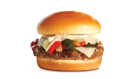 New Loaded Philly Steakburger from IHOP is piled high with sautéed onions and peppers and smothered with melted White Cheddar cheese and Cheddar cheese sauce. (Photo: Business Wire)